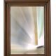 Mirror, bevelled glass and carved wooden frame.