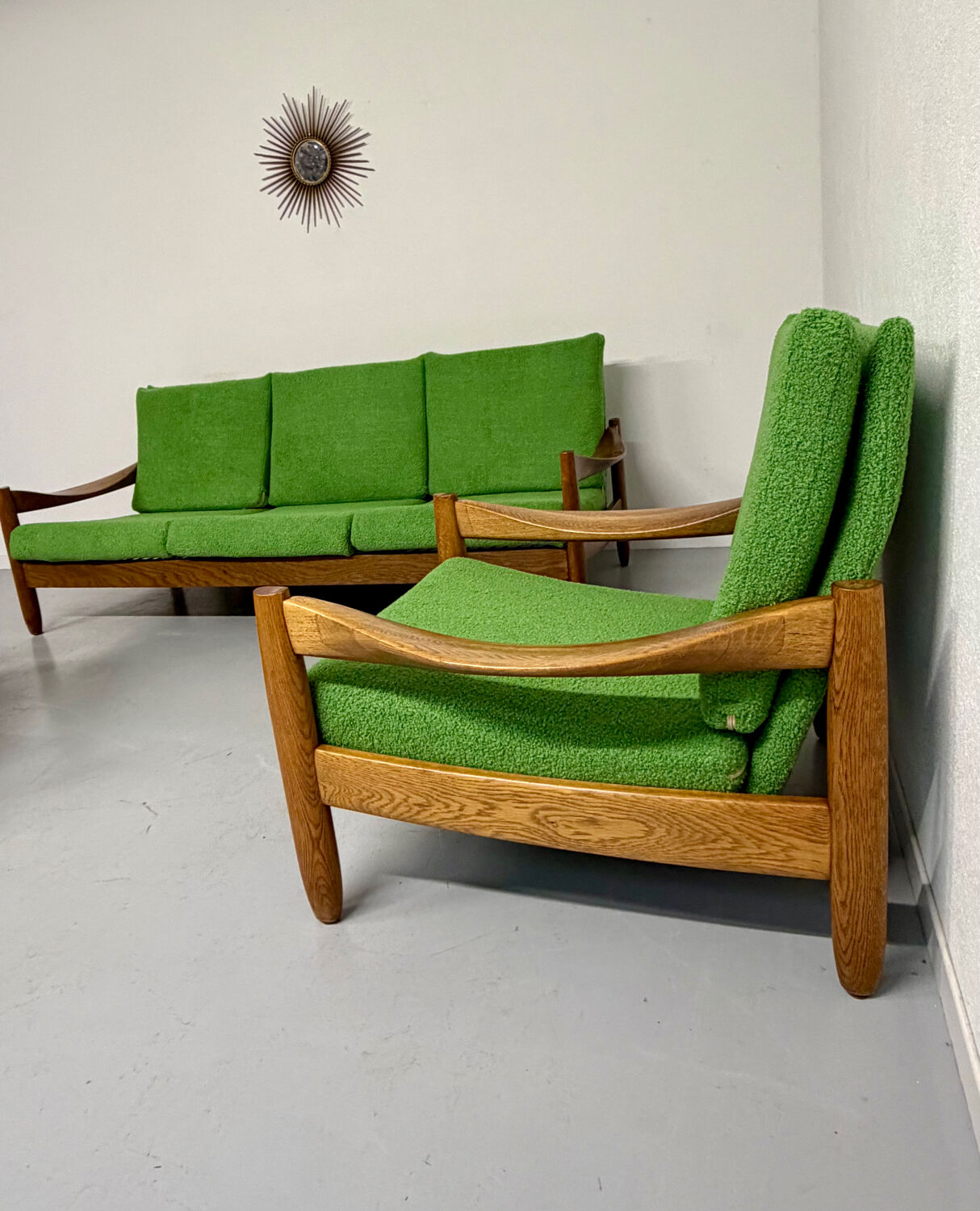 Living room sofa and Scandinavian design armchairs from the 1960s in green boucle.