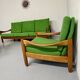 Living room sofa and Scandinavian design armchairs from the 1960s in green boucle.