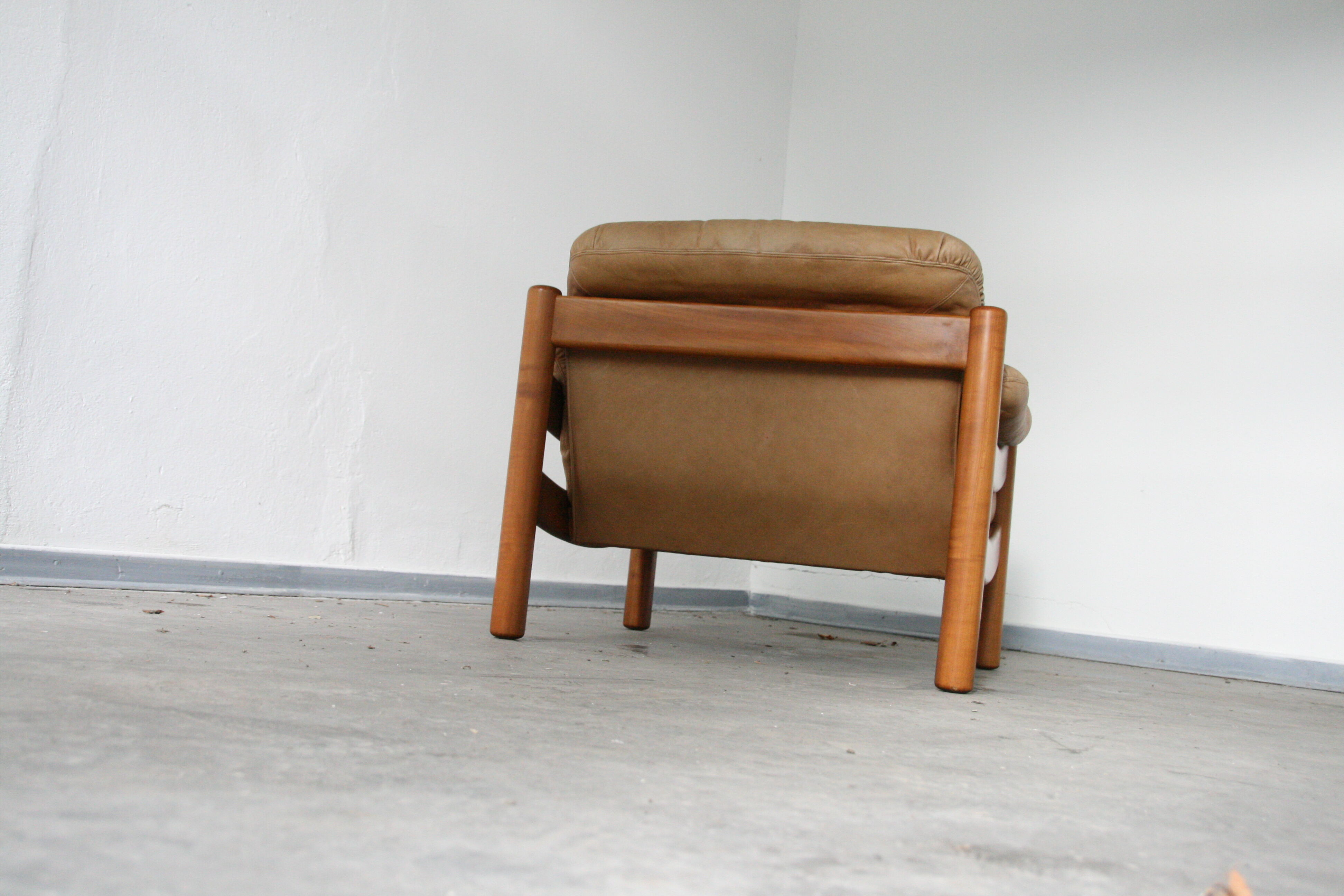 Teak and leather club armchairs