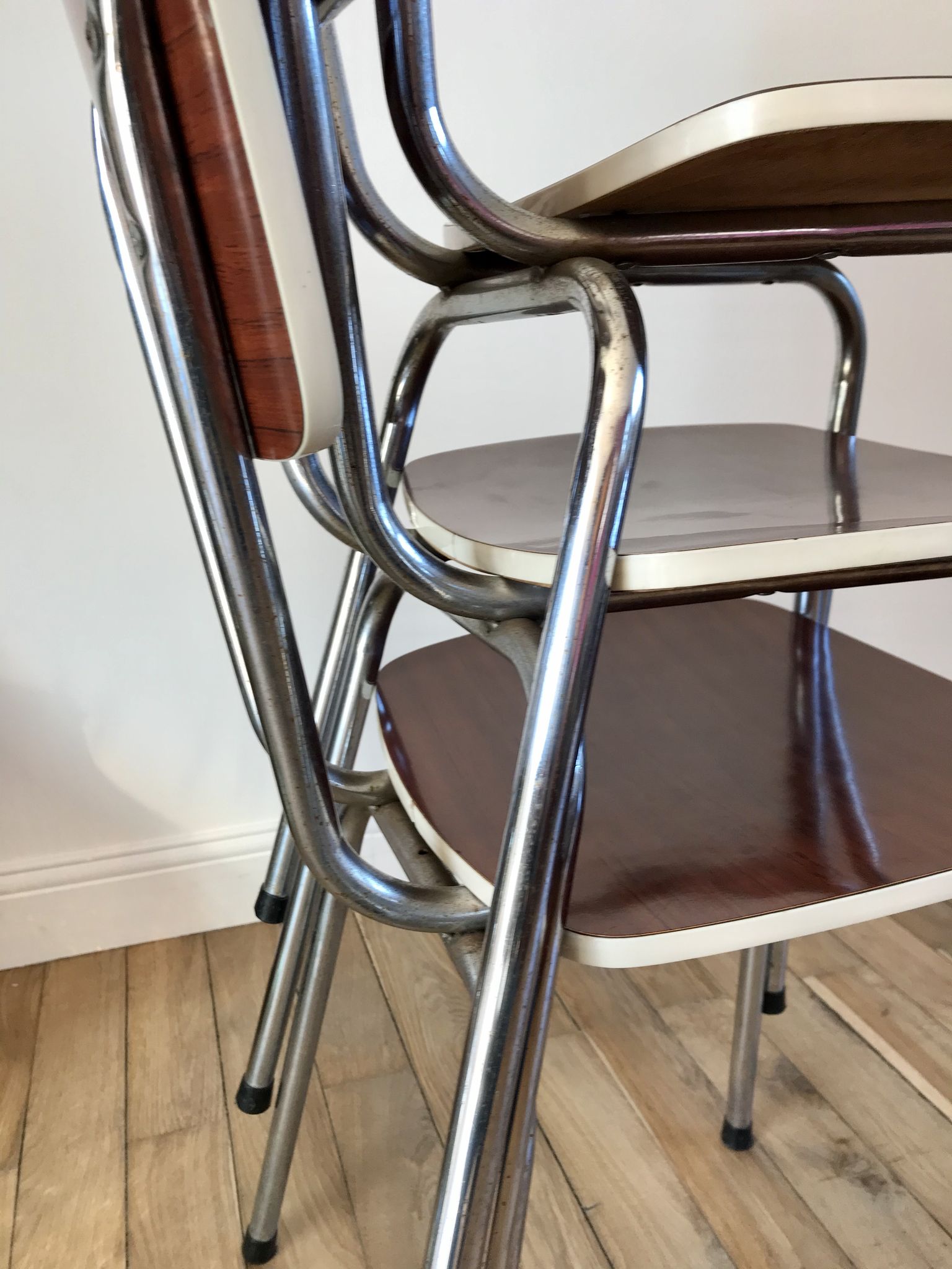 Trio of chairs in light brown formica and cream contour 70s