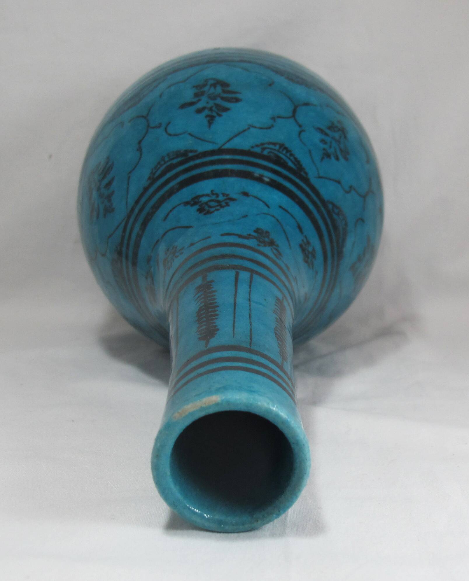 Islamic ceramic vase with turquoise background