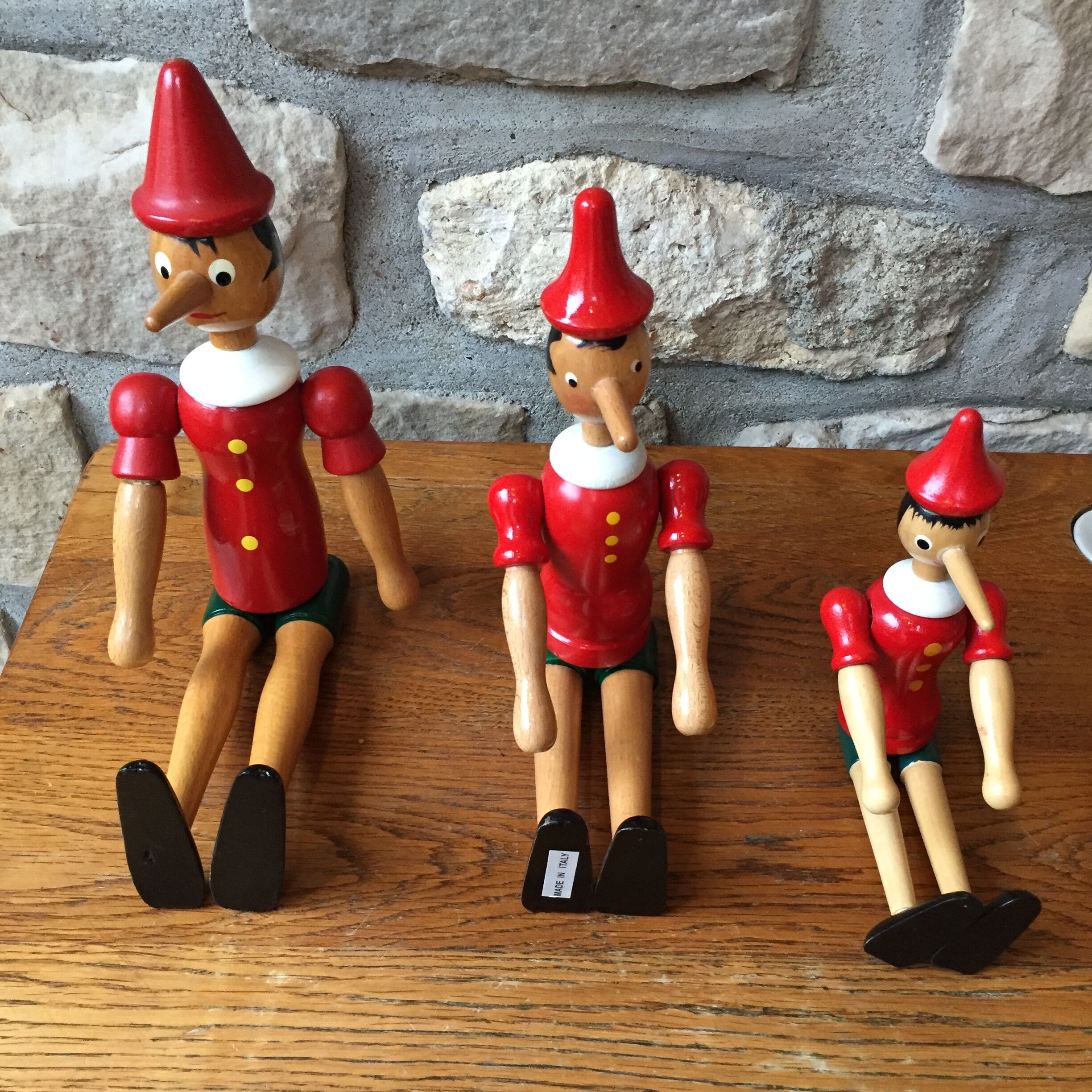 Trio of old wooden Pinocchio Made in Italy