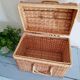 Small suitcase in vintage rattan trunk