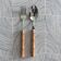 Pair of stainless steel and boxwood cutlery