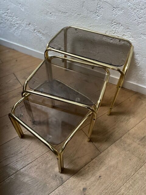 Series of 3 nesting tables in smoked glass & gilded brass