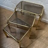 Series of 3 nesting tables in smoked glass & gilded brass