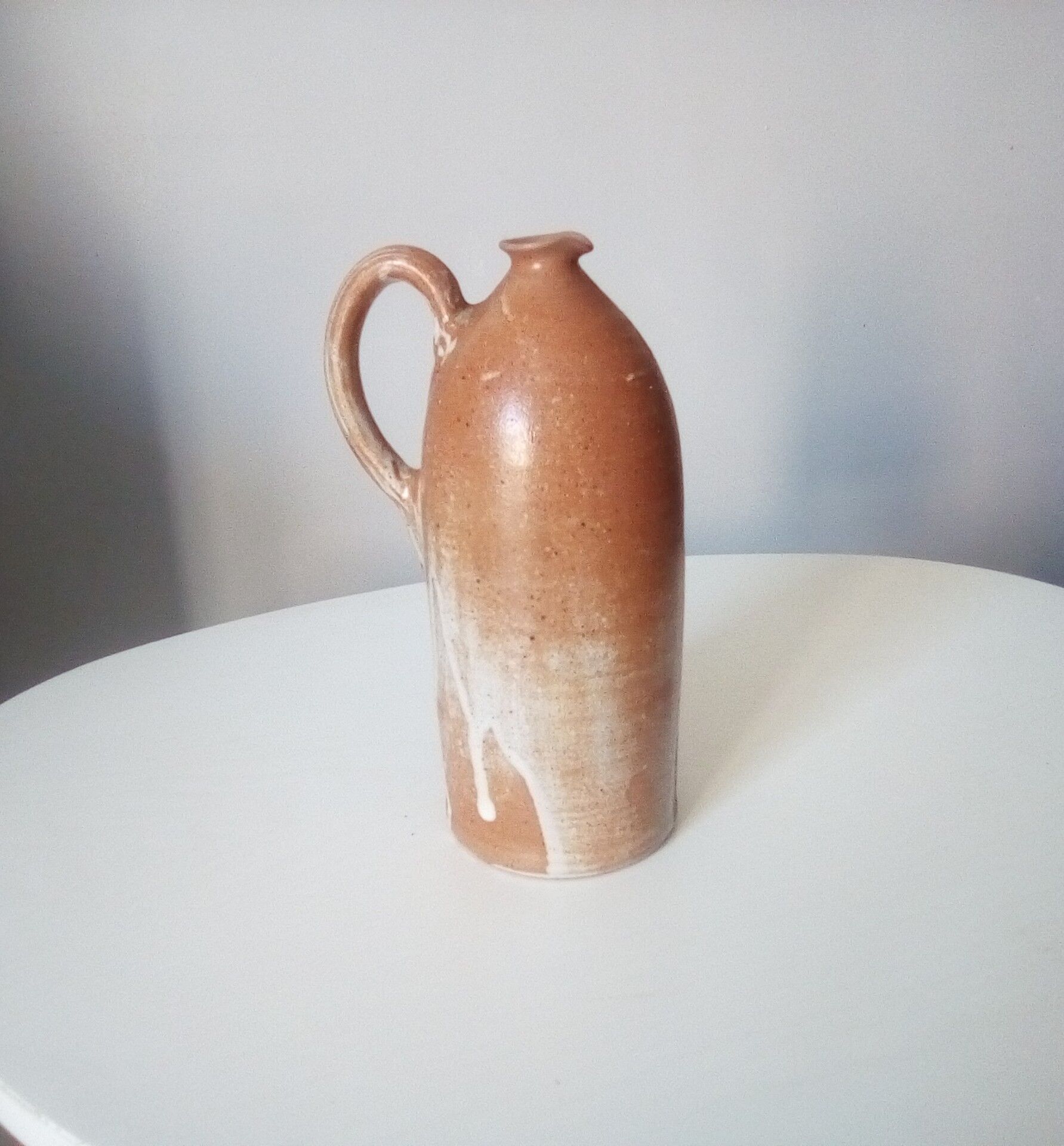 Vintage pitcher jug in sandstone