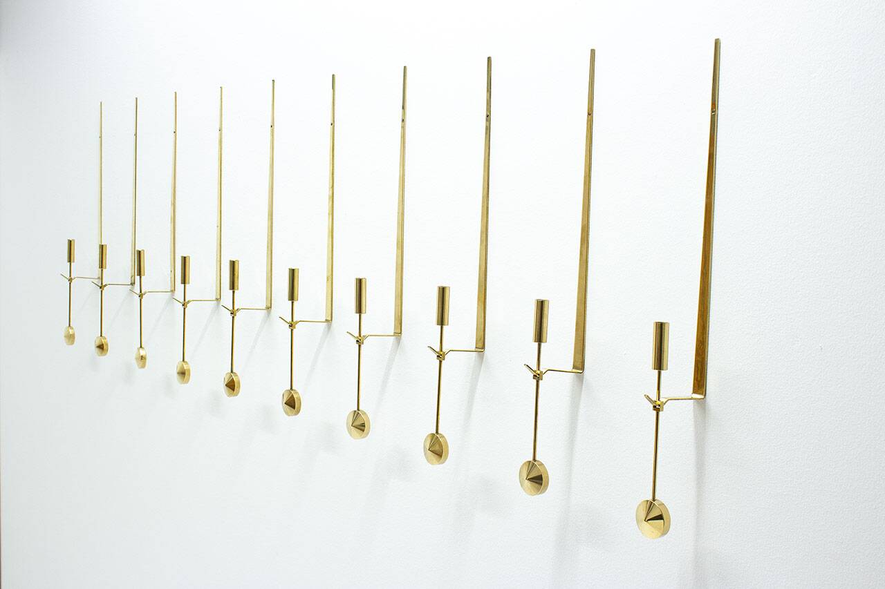Group of 10 Swedish brass candle sconces by Pierre Forssell for Skultuna