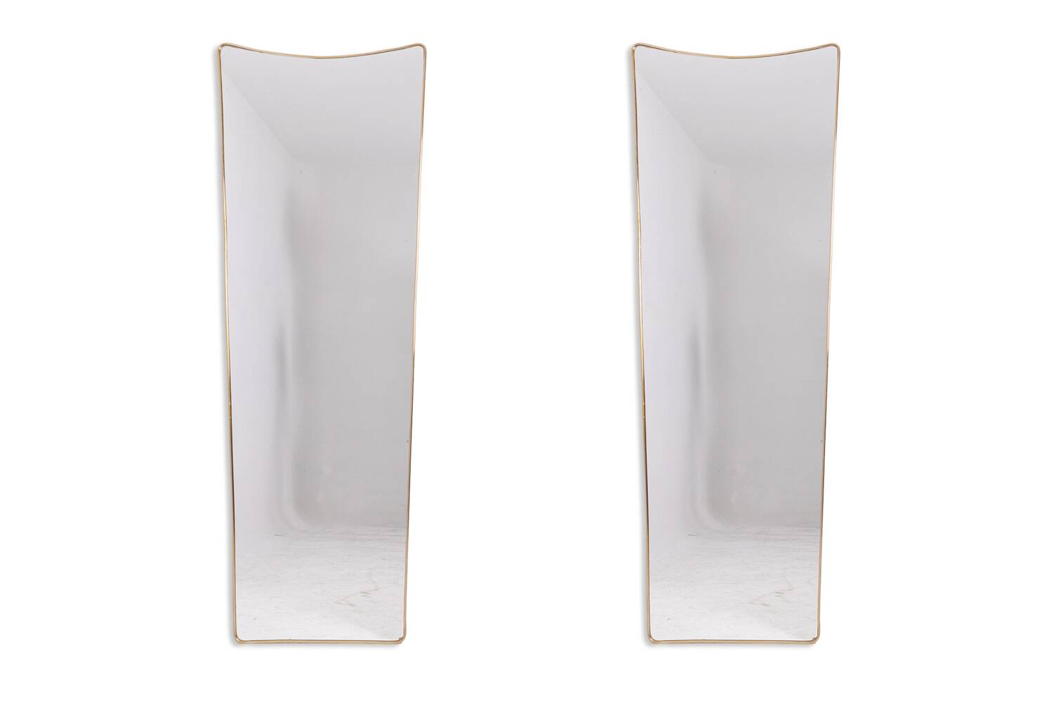 Pair of narrow gilt brass mirrors. Circa 1970.