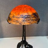 Contemporary mushroom lamp, wrought iron base and shaded orange glass shell