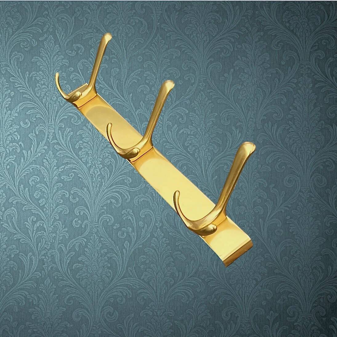 Vintage wall-mounted coat rack in anodised gold aluminium with 3 hooks from the 1970s.