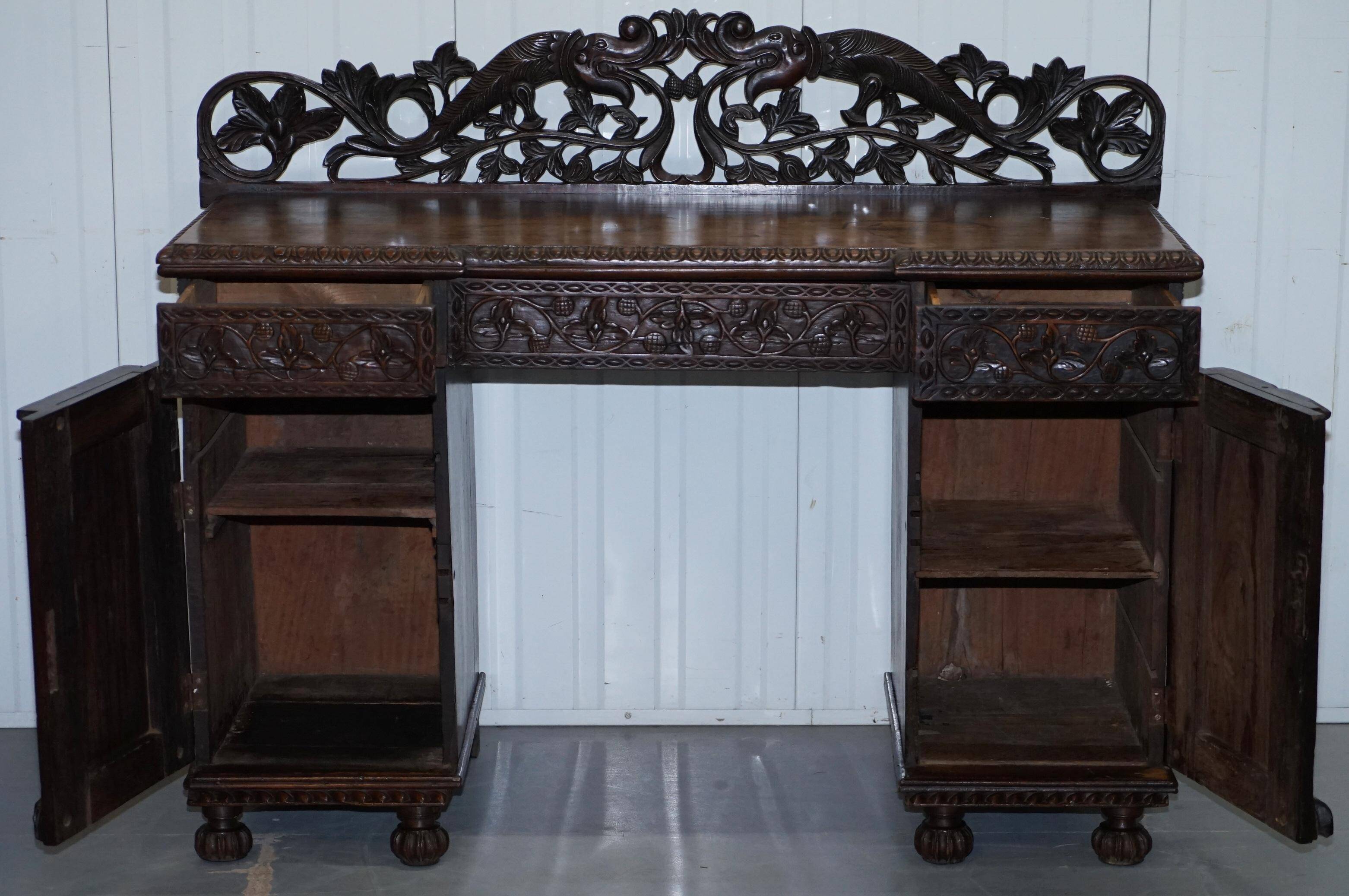 19th-century hand-carved Anglo-Burmese buffet with drawers and cupboards.