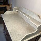 Antique wood and marble kitchen sideboard with carved backsplash