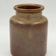 Vintage cylindrical ceramic workshop vase with speckled brown glaze.