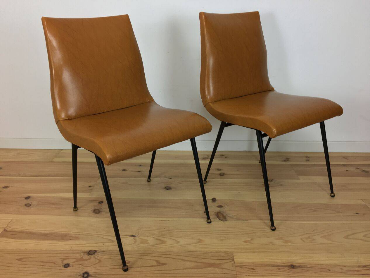 Pair of 1950s chairs with compass legs and brown faux leather.