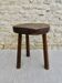 Tabouret tripode en bois brut