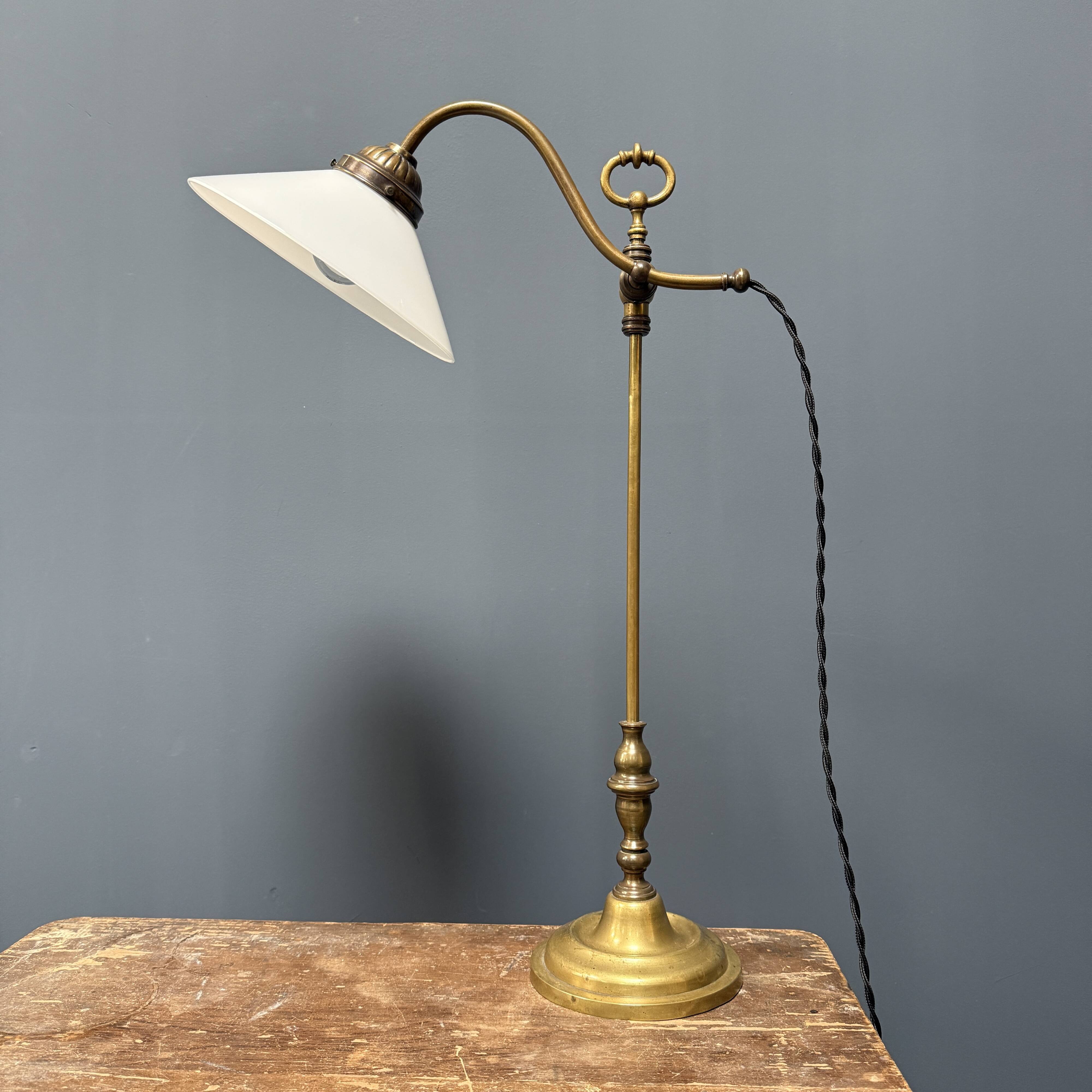 Adjustable brass table lamp with opaline glass shade
