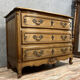 Curved Louis XV style chest of drawers in solid wood with a light patina