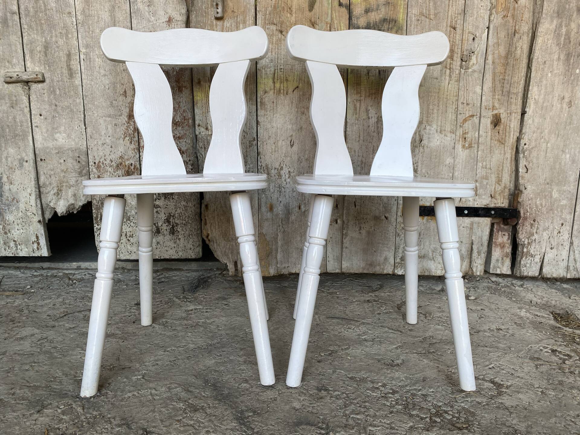 Pair of vintage white wooden bistro chairs