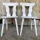 Pair of vintage white wooden bistro chairs