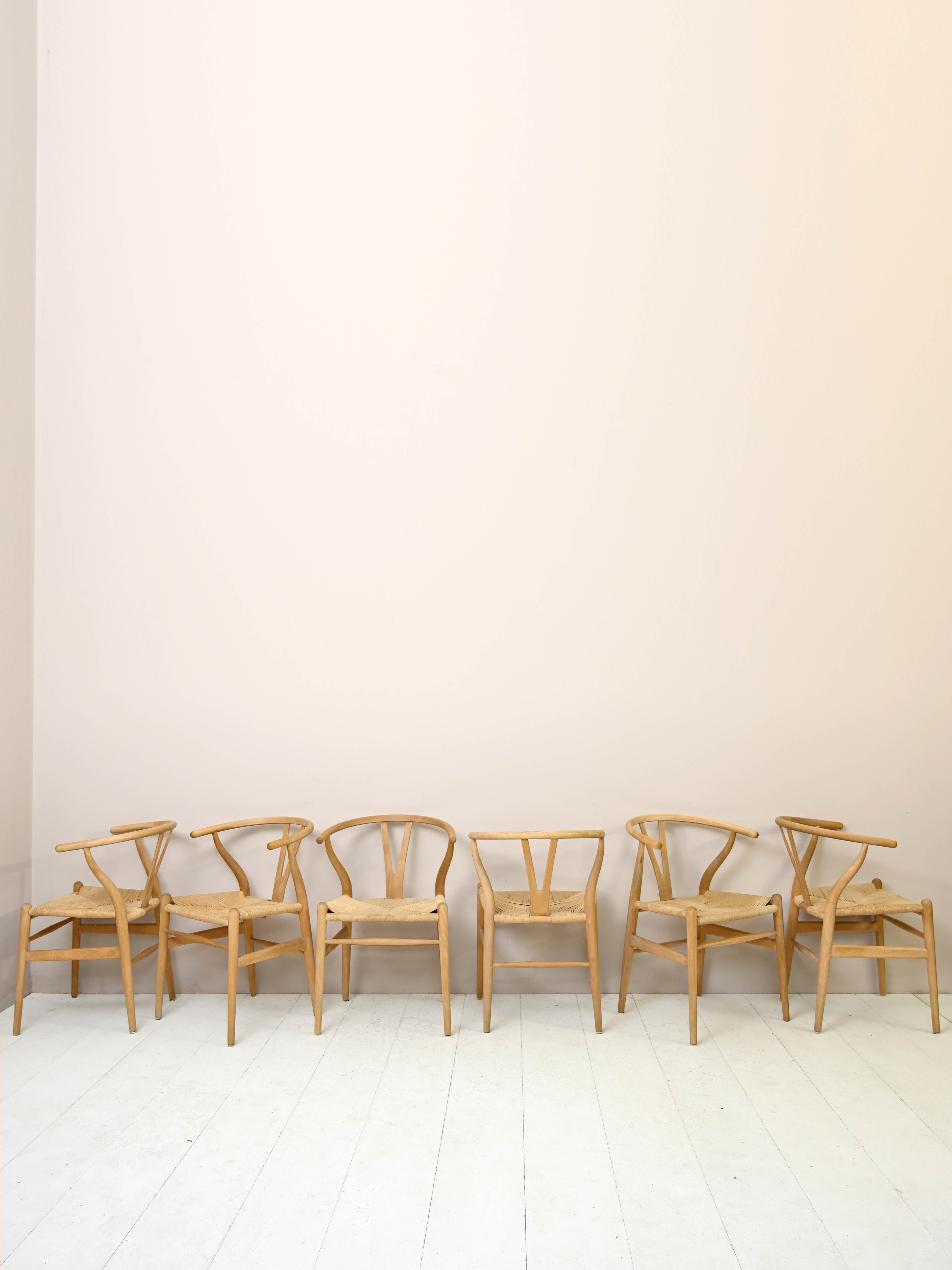 Set of six 'Wishbone chair' model chairs by Hans J. Wegner with leather cushions