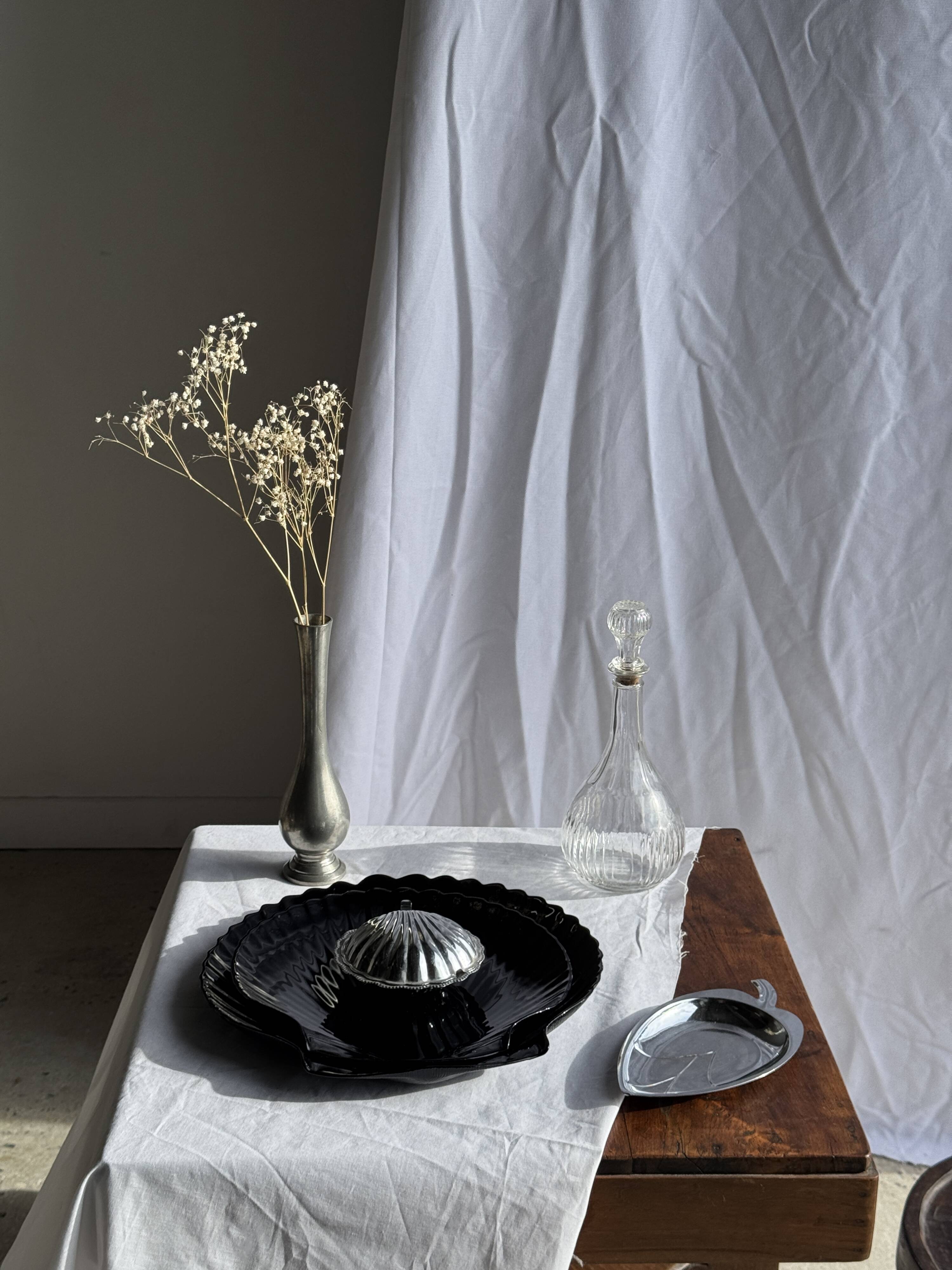 Pair of vintage black glass shell dishes D32 and D26