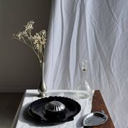 Pair of vintage black glass shell dishes D32 and D26