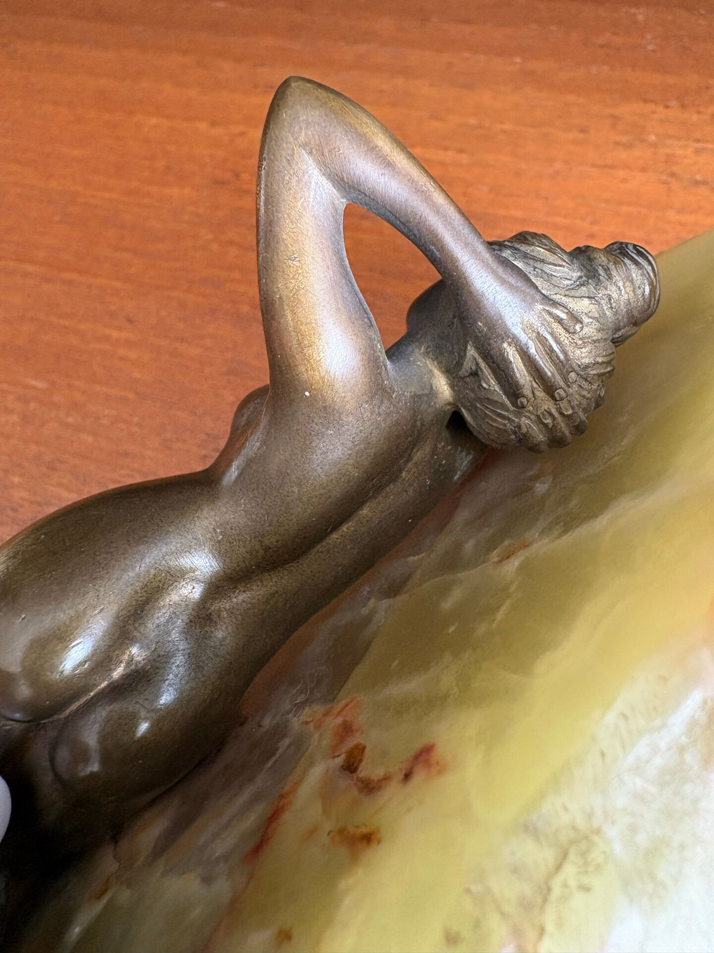 Art Deco female sculpture in bronze with onyx base.
