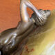 Art Deco female sculpture in bronze with onyx base.
