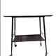 Dark wood serving trolley, 1950