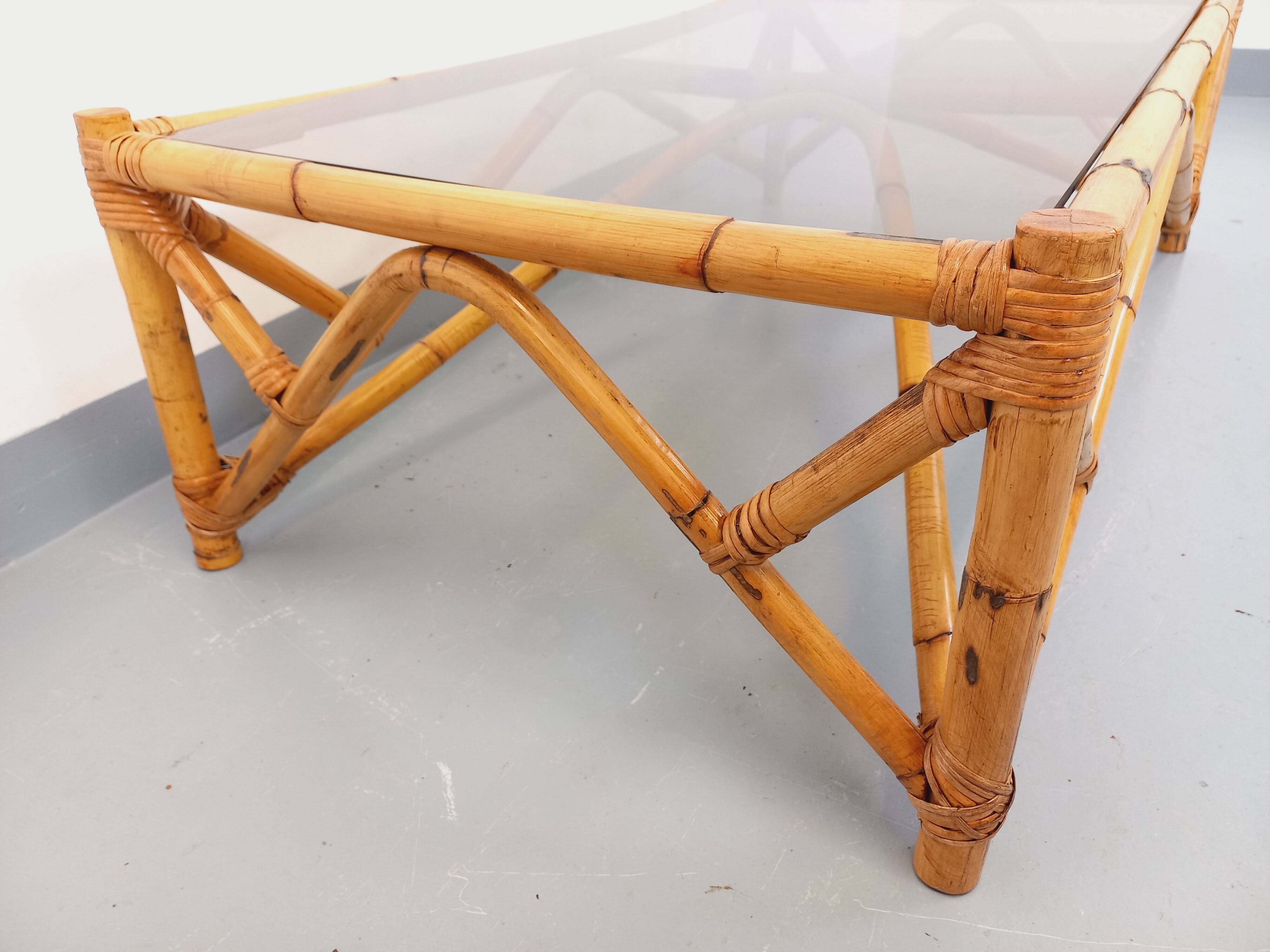 Vintage rectangular coffee table in rattan and smoked glass from the 1970s.