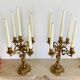 Solid bronze candlesticks decorated with putti, acanthus leaves and lion heads