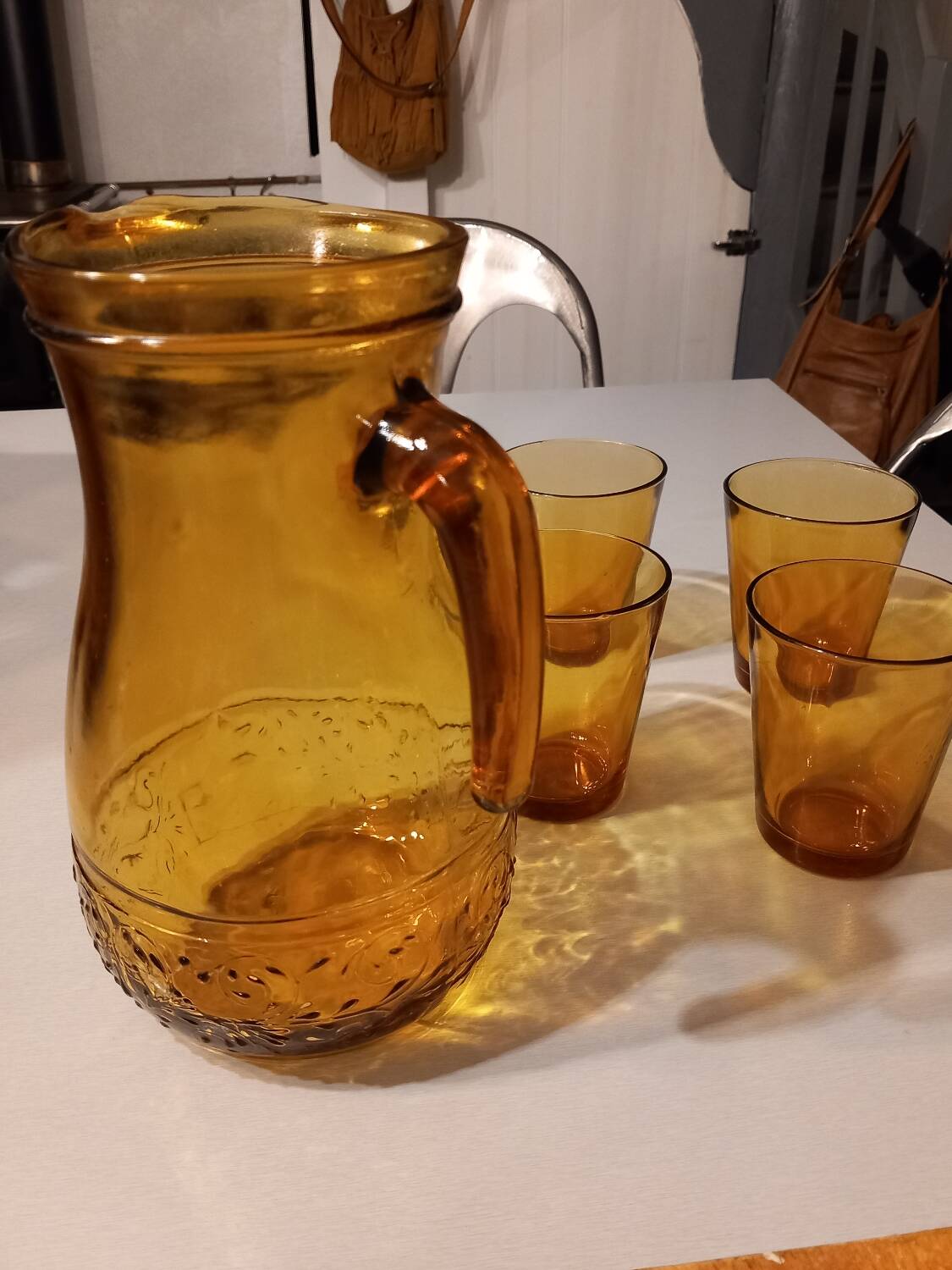 Italian pitcher service and 6 amber glasses