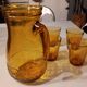Italian pitcher service and 6 amber glasses