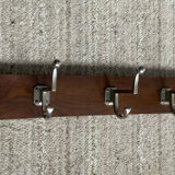 Wall coat rack from the 1950s-60s in solid oak and stainless steel.