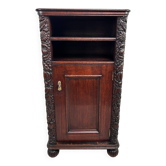 Art Nouveau cabinet with a shelf featuring distinctive floral sculptures.