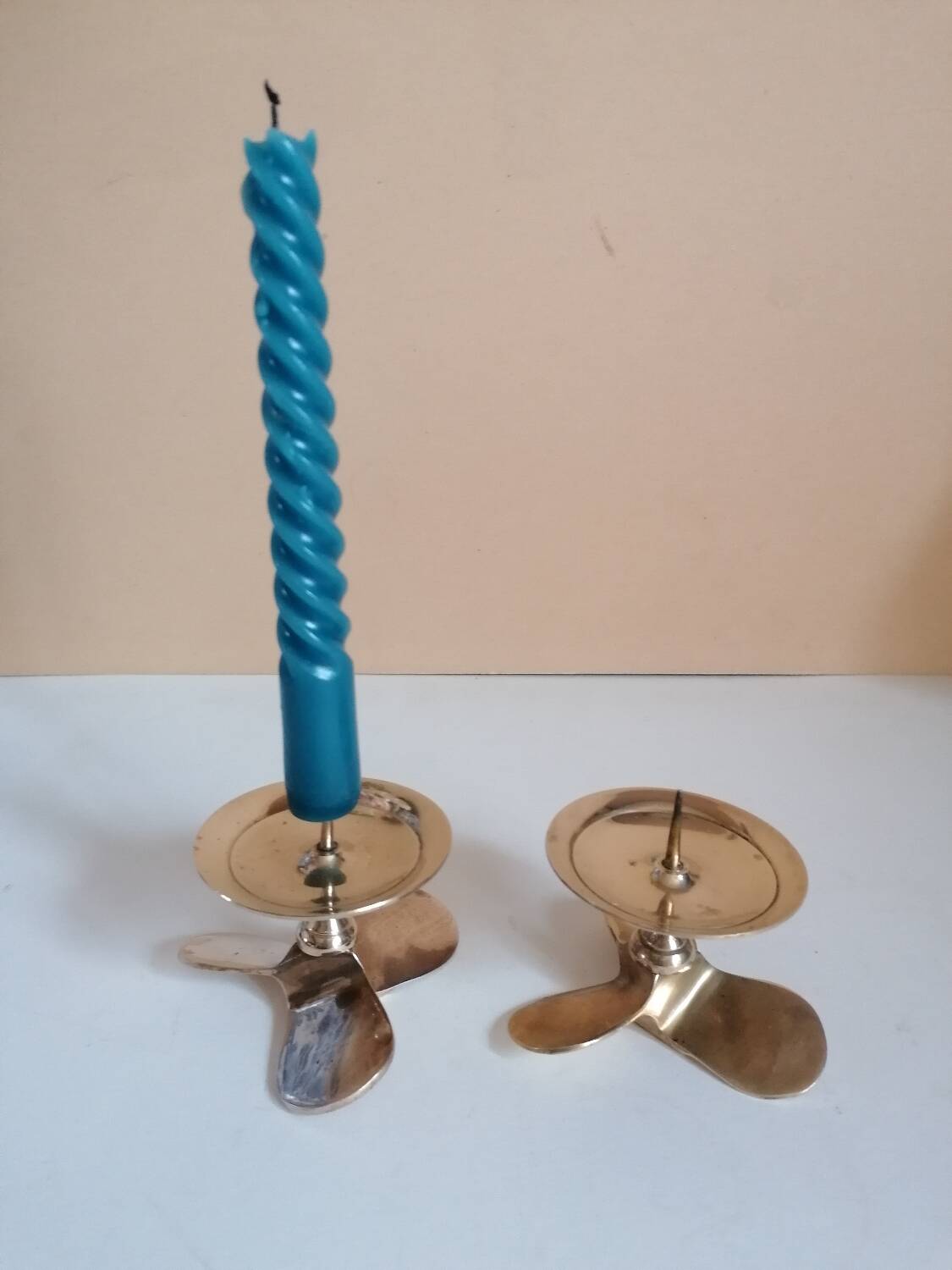 Two brass aviation propeller candle holders
