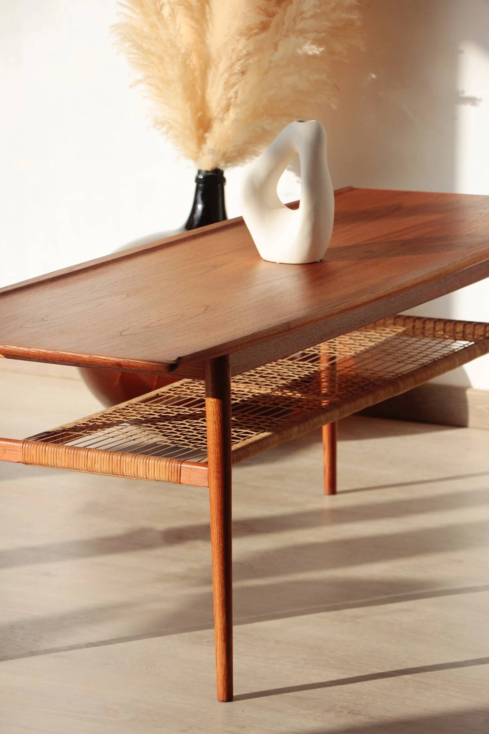 Vintage Scandinavian coffee table in teak and rattan – Danish design from the 1960s.