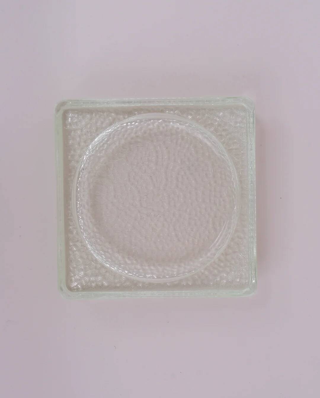 Pressed glass pocket emptier