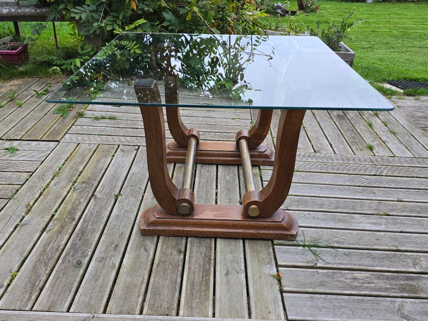 Art Deco coffee table in glass, wood, and brass.