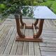 Art Deco coffee table in glass, wood, and brass.