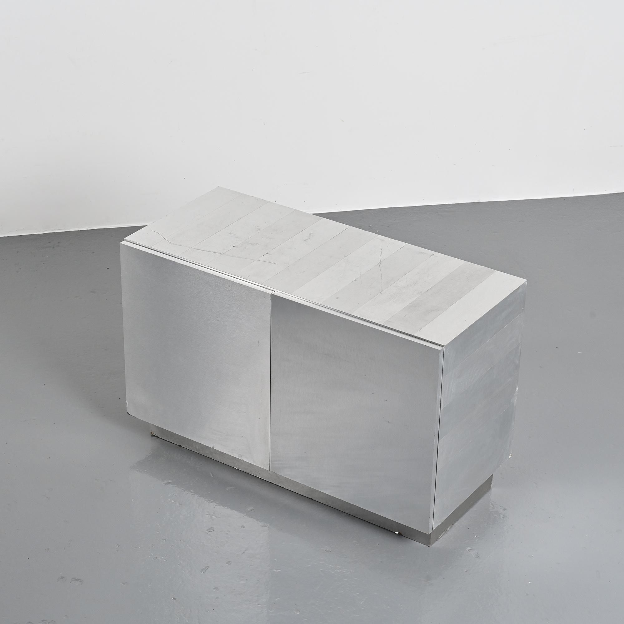 Pair of low buffets in brushed metal, French work, 1970s.