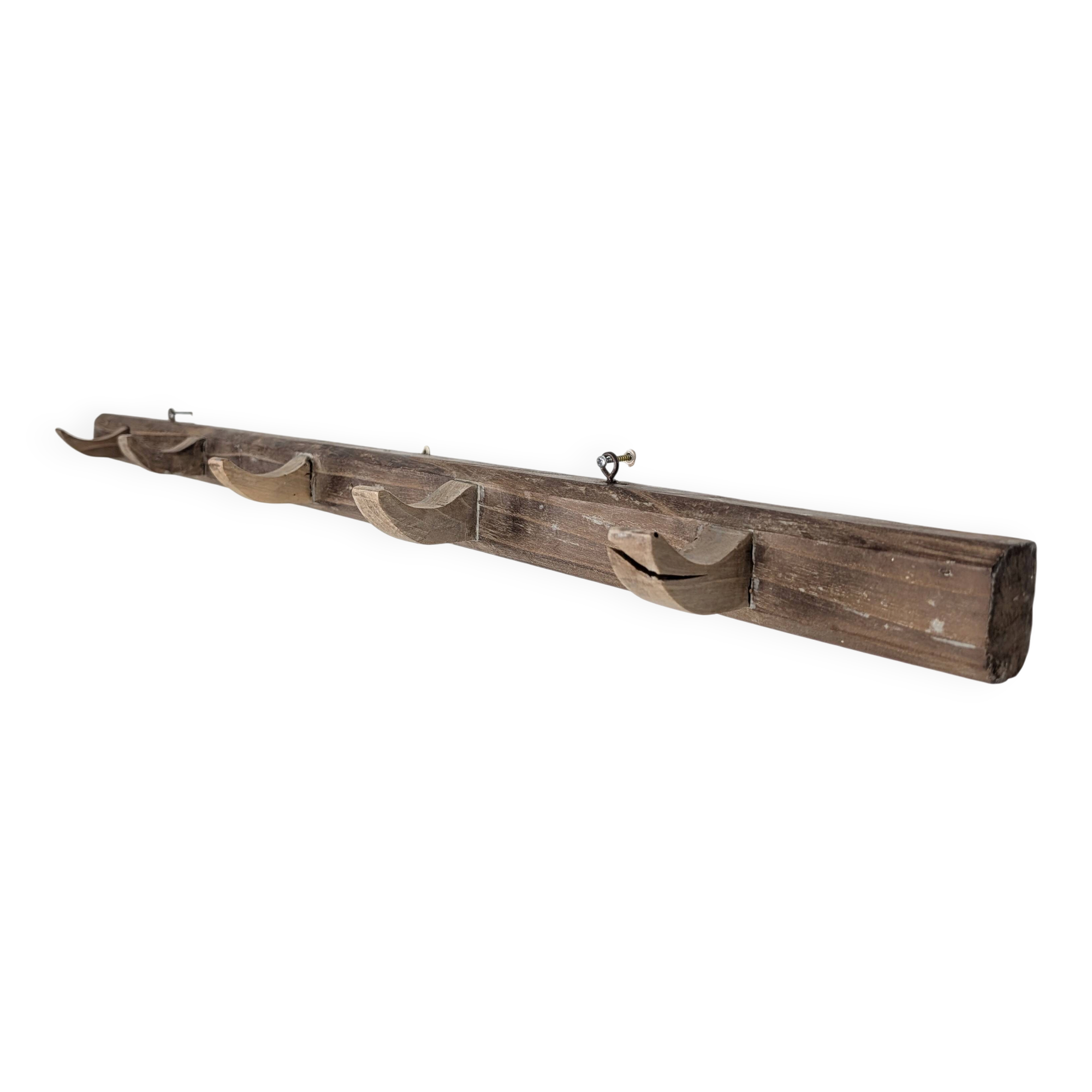 Handcrafted wall coat rack in raw wood