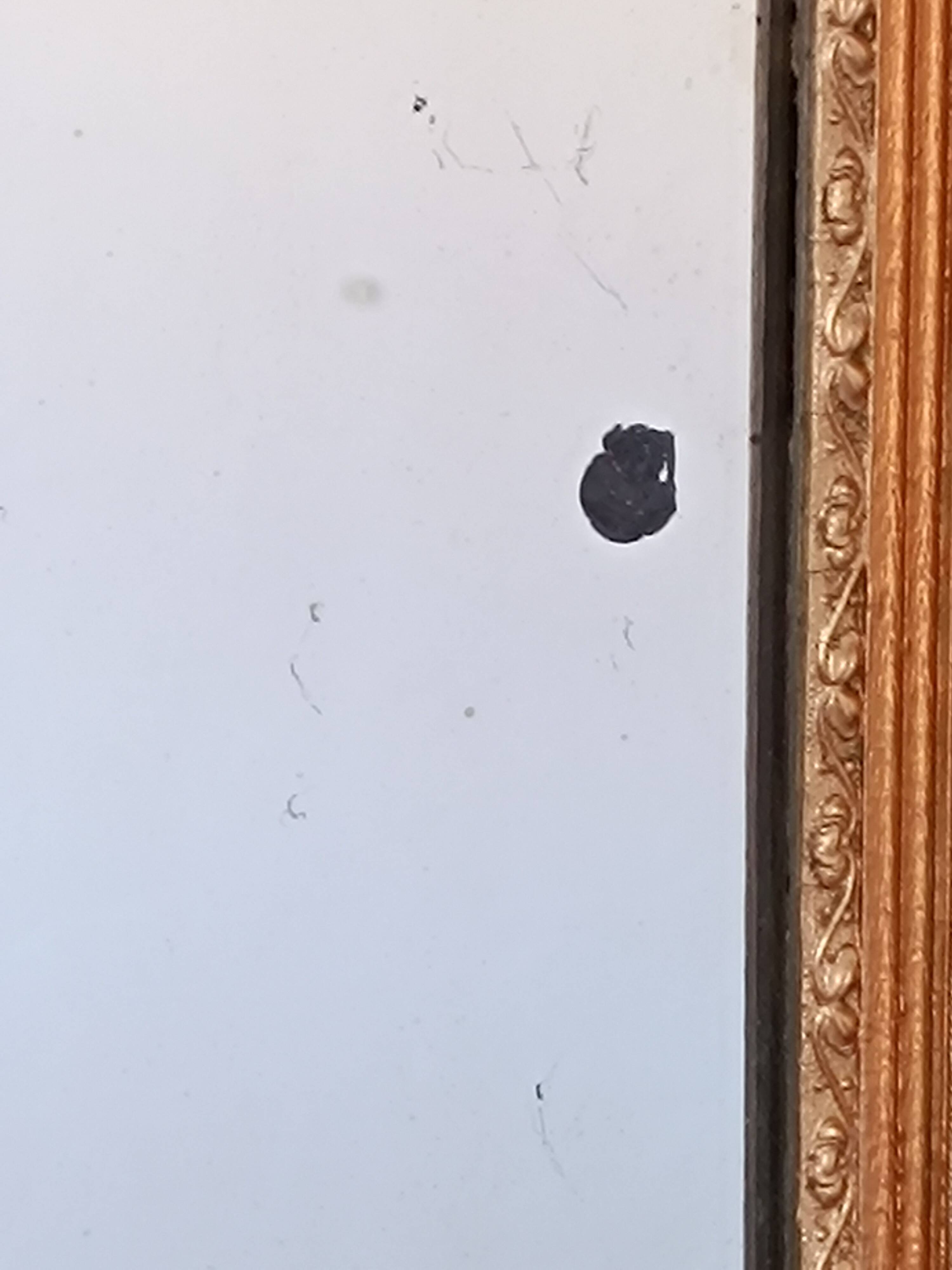 Miroir Napoléon III a riche ornementation dorée