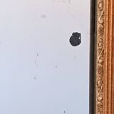 Miroir Napoléon III a riche ornementation dorée