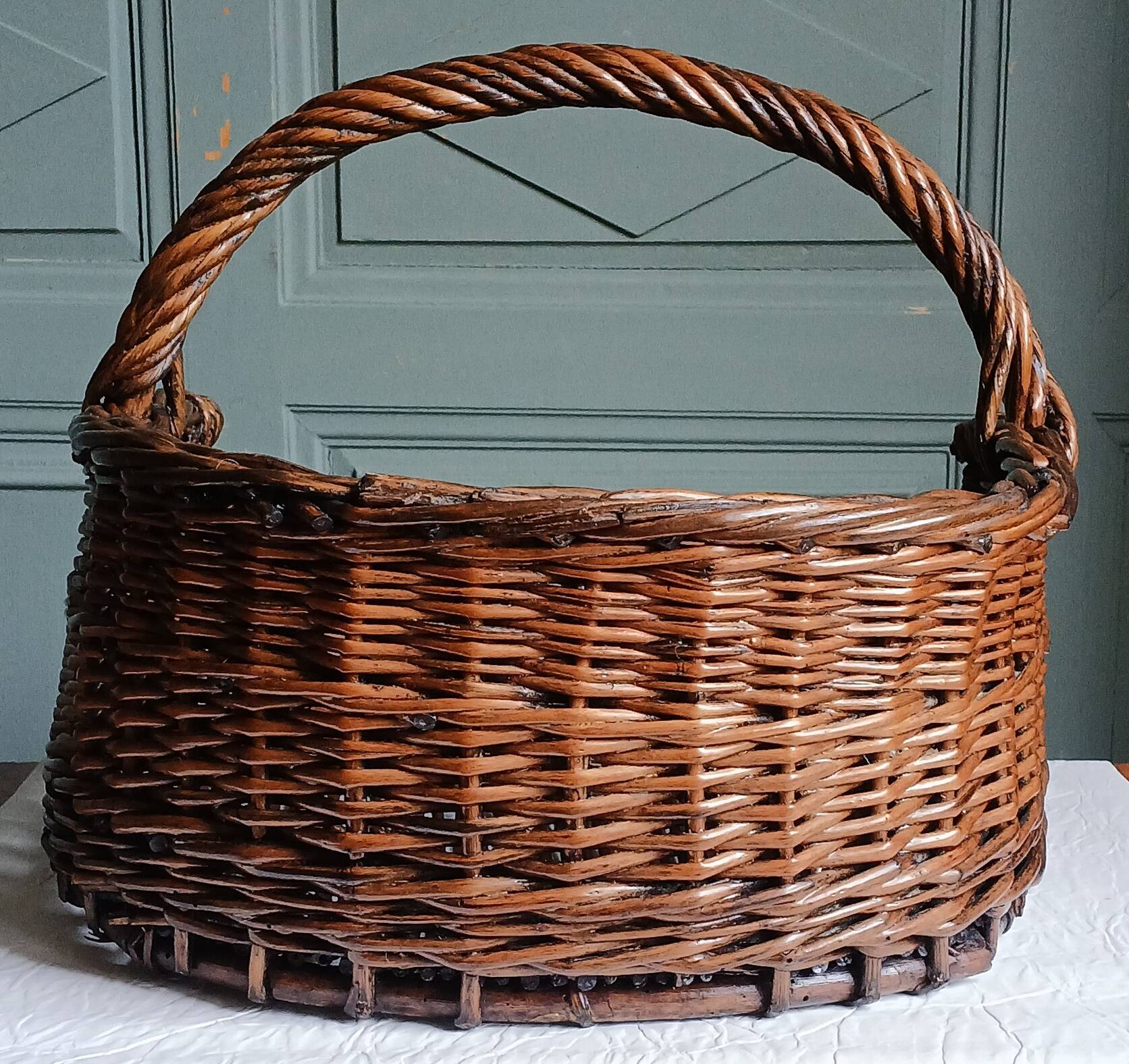 Handmade woven and dyed willow harvest basket.