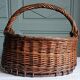 Handmade woven and dyed willow harvest basket.