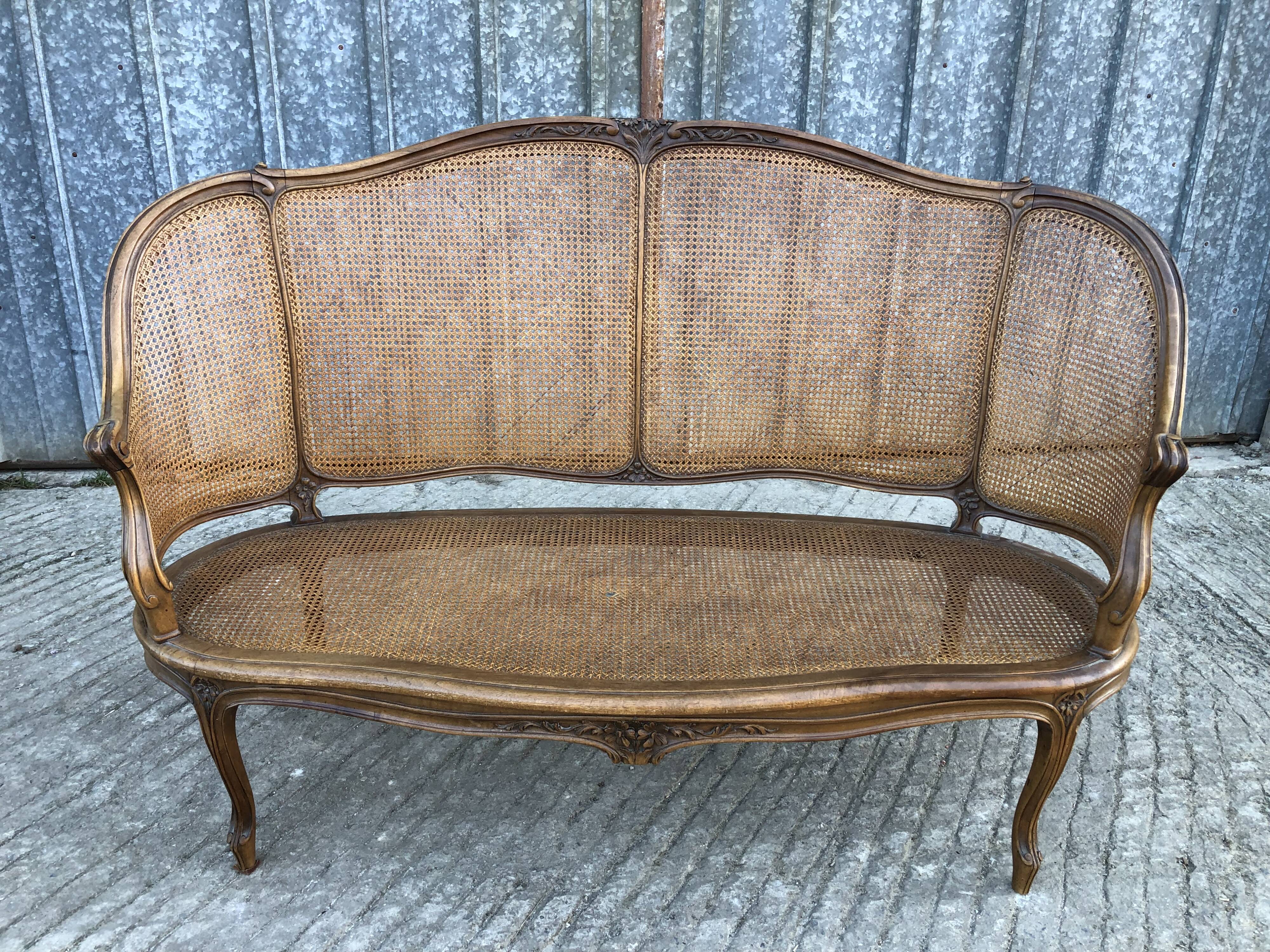Antique Louis XV bench in solid walnut and caning