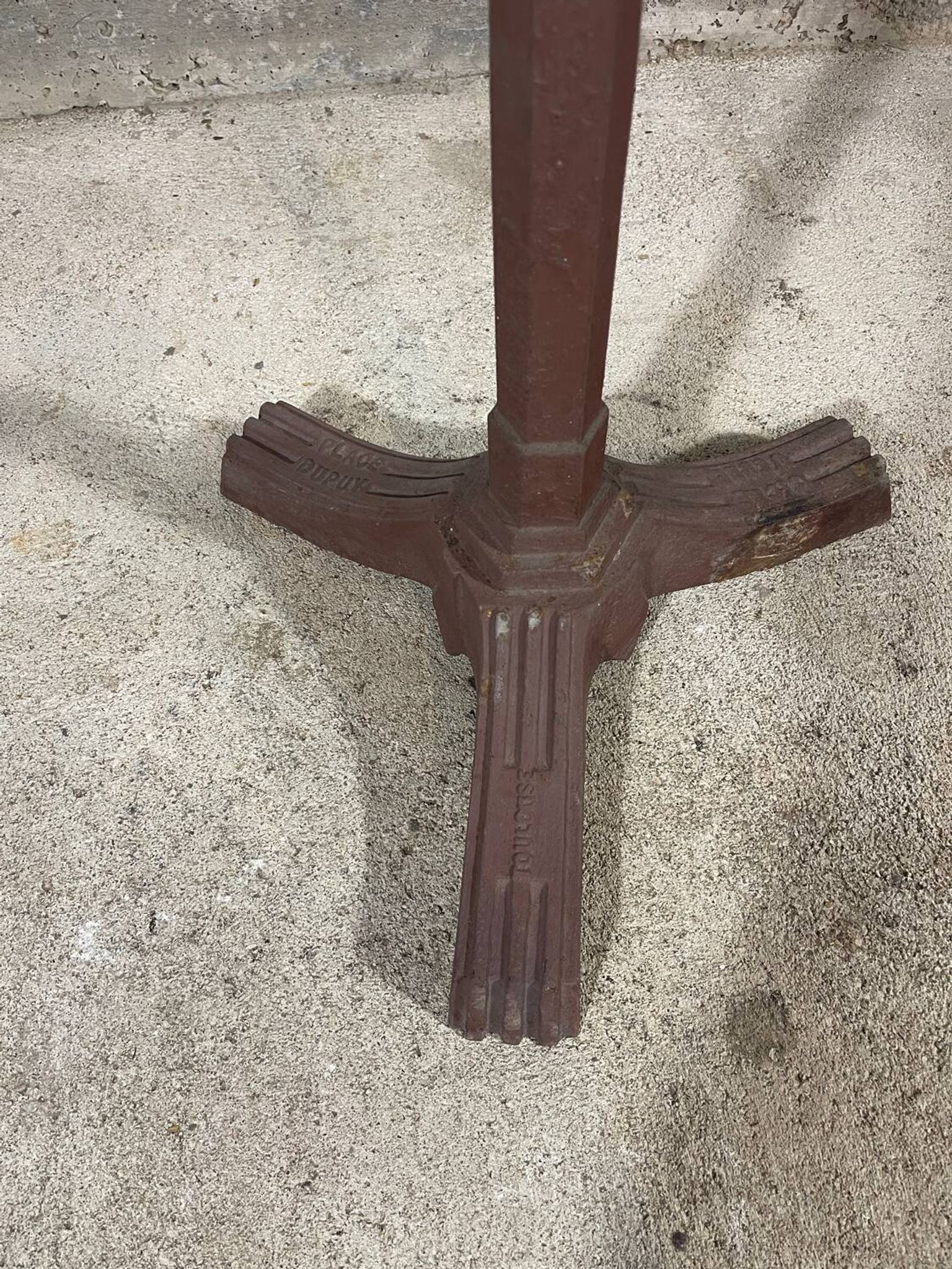 Bistro table with a cast iron base